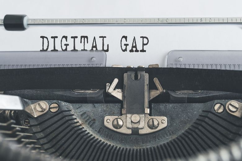 Typewriter with the words 'Digital Gap' printed