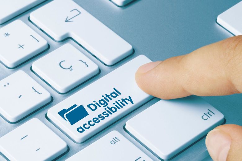 person pressing a digital accessibility key on a keyboard